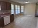 Open-concept kitchen and dining area boasting tile floors and lots of natural light at 7450 Cobblestone W Dr, Indianapolis, IN 46236