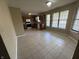 Spacious kitchen featuring tile flooring, ample natural light, wooden cabinetry, and modern appliances at 7450 Cobblestone W Dr, Indianapolis, IN 46236
