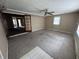 Large living room with tile and doors to additional space at 7450 Cobblestone W Dr, Indianapolis, IN 46236