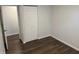 Bedroom with wood flooring, neutral walls, and closet at 823 N Noble St, Greenfield, IN 46140