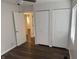 Bedroom features a ceiling fan, two closets, and vinyl flooring at 823 N Noble St, Greenfield, IN 46140