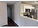 Bright kitchen features white cabinets, stainless steel appliances, and modern countertops at 823 N Noble St, Greenfield, IN 46140