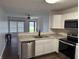 Modern kitchen featuring stainless steel appliances, granite countertops, and white cabinetry at 823 N Noble St, Greenfield, IN 46140