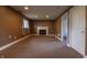 Basement features a fireplace and an adjacent room with a door, highlighting the basement's layout at 8232 N Chaucer Ct, Columbus, IN 47201