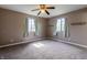 Bedroom featuring carpeted floors, dual windows with sheer curtains, and neutral paint at 8232 N Chaucer Ct, Columbus, IN 47201