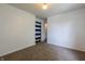Bedroom with carpeted floor, white walls, and view into hallway at 8232 N Chaucer Ct, Columbus, IN 47201