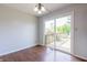 Bright dining room featuring new flooring and sliding glass door leading to outdoor deck at 8232 N Chaucer Ct, Columbus, IN 47201