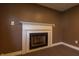 Close-up of a decorative fireplace, highlighting its design and its role as a cozy focal point in the basement at 8232 N Chaucer Ct, Columbus, IN 47201