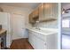 Bright kitchen boasting appliances, decorative backsplash and updated white cabinetry at 8232 N Chaucer Ct, Columbus, IN 47201
