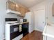 Efficient kitchen featuring appliances, wood cabinets and new, stylish hardware at 8232 N Chaucer Ct, Columbus, IN 47201