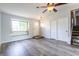 Stylish living room featuring new flooring, vaulted ceilings and large picture window at 8232 N Chaucer Ct, Columbus, IN 47201