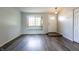 Modern living room features new flooring, bay window and decorative ceiling fan at 8232 N Chaucer Ct, Columbus, IN 47201