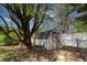 Shed in backyard, providing useful space for storage and gardening, sheltered under a mature shade tree at 8232 N Chaucer Ct, Columbus, IN 47201