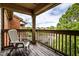 Relaxing balcony with a chair, wood flooring, and views of the neighborhood at 8911 Hunters Creek Dr # 311, Indianapolis, IN 46227