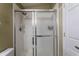 Bright bathroom with a glass enclosed shower with chrome trim at 8911 Hunters Creek Dr # 311, Indianapolis, IN 46227