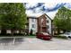 Attractive condominium with brick accents and well-maintained landscaping, and reserved parking spaces at 8911 Hunters Creek Dr # 311, Indianapolis, IN 46227