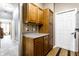 Bright kitchen with stainless steel refrigerator and wooden cabinetry at 8911 Hunters Creek Dr # 311, Indianapolis, IN 46227