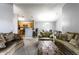 Open-concept living space with a view of the kitchen, dining area, and comfortable furnishings at 8911 Hunters Creek Dr # 311, Indianapolis, IN 46227