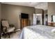 Well-lit main bedroom featuring carpeted floors and a flat screen television on a wooden dresser at 8911 Hunters Creek Dr # 311, Indianapolis, IN 46227