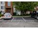 Parking lot with reserved spots in front of a well-maintained building with landscaping at 8911 Hunters Creek Dr # 311, Indianapolis, IN 46227