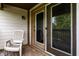 Cozy patio with a chair, sliding glass door, and a screen door at 8911 Hunters Creek Dr # 311, Indianapolis, IN 46227