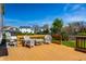 Relaxing back deck with white wicker furniture, overlooks a lush yard with mature trees at 8966 Wooster Ct, Fishers, IN 46038