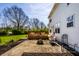 Expansive backyard patio with a wooden deck, ideal for outdoor gatherings and relaxation at 8966 Wooster Ct, Fishers, IN 46038
