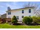 Backyard view featuring a deck, patio, white siding, and well maintained lawn at 8966 Wooster Ct, Fishers, IN 46038