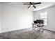 Spacious bedroom featuring plush carpeting and a dedicated workspace with modern desk and chair, ideal for productivity at 8966 Wooster Ct, Fishers, IN 46038