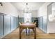 Inviting dining room featuring modern lighting and a large wooden table with seating for six at 8966 Wooster Ct, Fishers, IN 46038