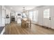 Eat-in kitchen featuring white cabinets, stainless steel appliances, and a dining area with ample natural light at 8966 Wooster Ct, Fishers, IN 46038