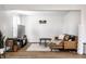 Comfortable living area with a plush leather chair, patterned rug, and modern decor at 8966 Wooster Ct, Fishers, IN 46038