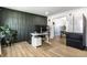 Home office featuring a standing desk, modern décor, and views into the adjacent dining room at 8966 Wooster Ct, Fishers, IN 46038