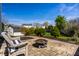 Cozy backyard patio with wicker furniture and a fire pit, perfect for outdoor entertaining at 8966 Wooster Ct, Fishers, IN 46038