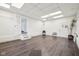 Spacious basement featuring waterproofed walls, tiled floors, and a walkout to the exterior at 90 S Morgantown Rd, Greenwood, IN 46142
