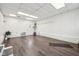 Spacious basement featuring waterproofed walls, tiled floors, and a walkout to the exterior at 90 S Morgantown Rd, Greenwood, IN 46142