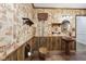 Vintage bathroom with unique wallpaper, a wood paneled wall, and retro fixtures at 90 S Morgantown Rd, Greenwood, IN 46142