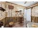 Vintage bathroom with unique wallpaper, a wood paneled wall, and retro fixtures at 90 S Morgantown Rd, Greenwood, IN 46142