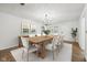 Bright dining room with a large wooden table, seating for eight, and stylish decor at 90 S Morgantown Rd, Greenwood, IN 46142