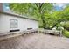 Outdoor patio with wooden benches, offering a comfortable and inviting space for relaxation and entertainment at 90 S Morgantown Rd, Greenwood, IN 46142