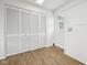 An additional room features a closet, a window, and durable wood-like flooring at 90 S Morgantown Rd, Greenwood, IN 46142