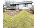 Backyard view of a home featuring a deck overlooking the lawn and surrounding homes at 952 Delray Dr, Indianapolis, IN 46241