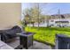 Relaxing backyard featuring a well-maintained lawn and a patio with a grill and firepit seating area at 9575 Thradd St, Fishers, IN 46038