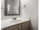 Bathroom with white sink, vanity and decorative mirror at 9575 Thradd St, Fishers, IN 46038