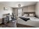 This bedroom is bright with a large window and features vinyl wood flooring at 9575 Thradd St, Fishers, IN 46038