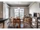 This open breakfast nook is bright and features a wooden table with seating for four at 9575 Thradd St, Fishers, IN 46038
