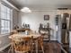 This open breakfast nook features a wooden table with seating for four and a drink station at 9575 Thradd St, Fishers, IN 46038