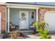 Cozy front porch featuring seating, a decorative wreath, and a well-maintained entrance at 9575 Thradd St, Fishers, IN 46038