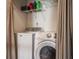 Laundry room featuring a white washer and dryer at 9575 Thradd St, Fishers, IN 46038