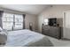 This spacious bedroom is bright and offers a view of the yard at 9575 Thradd St, Fishers, IN 46038